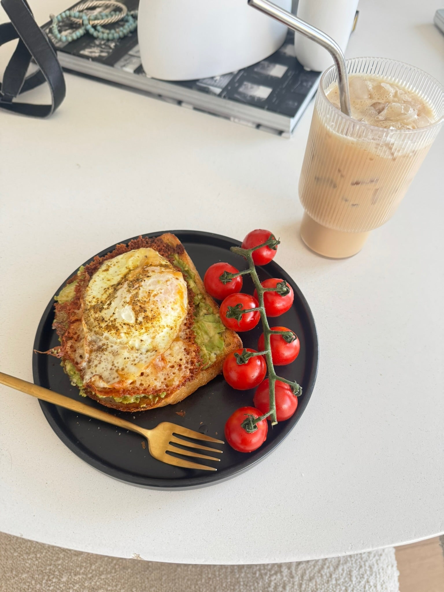 avocado toast with sunny side up eggs and tomatoes