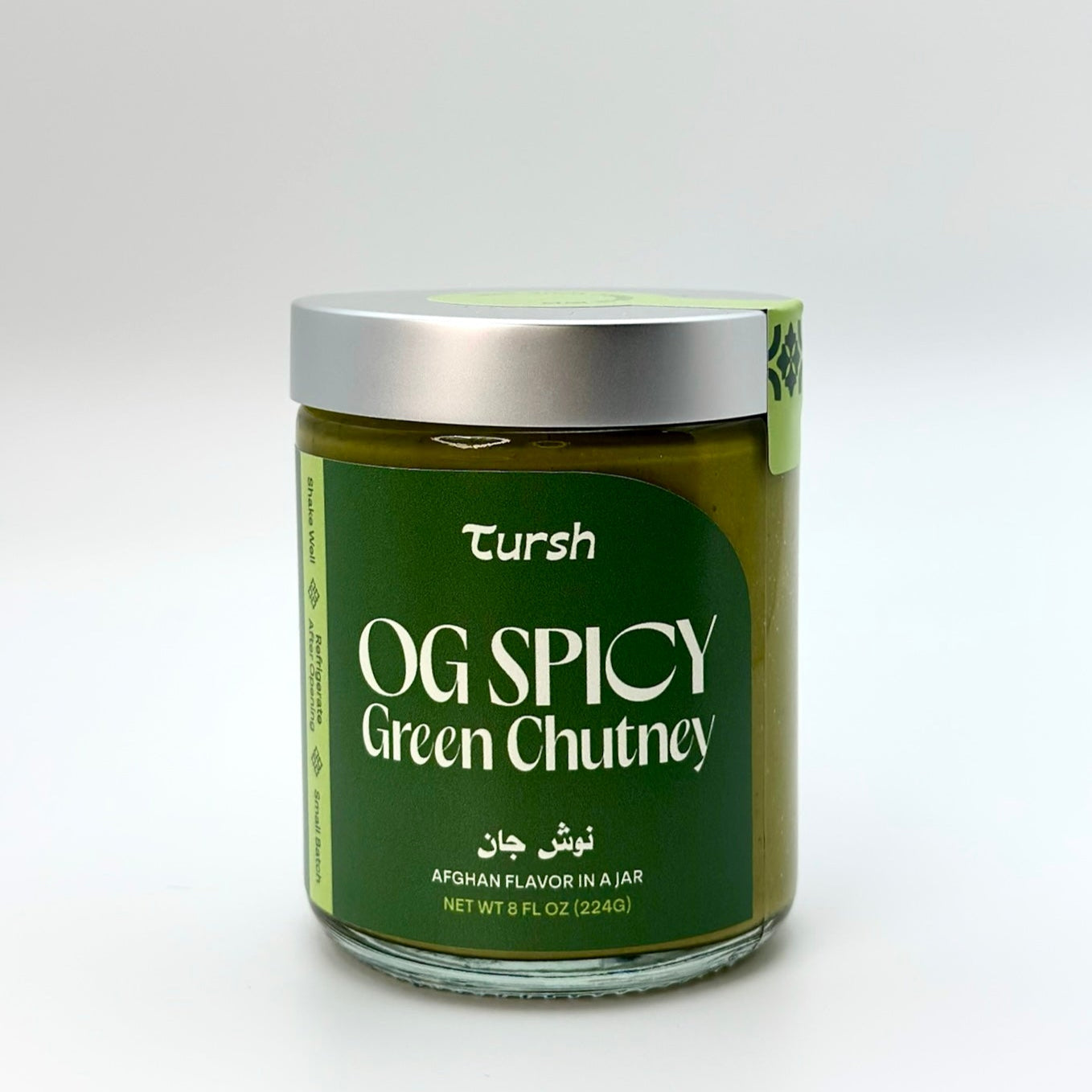8 oz jar of green chutney with white background 